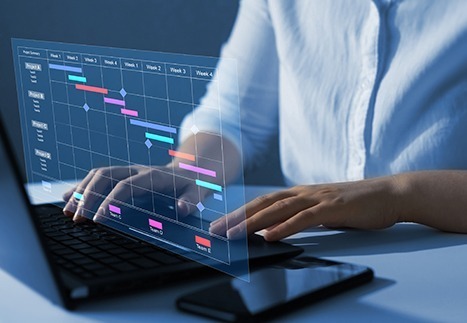 Manager working and updating tasks and milestones progress planning with Gantt chart scheduling interface for company on virtual screen